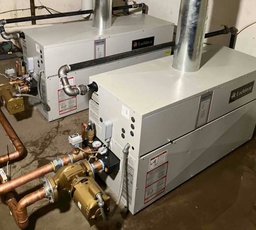 A multi-family property's boiler system is shown after service from a Rainforest Plumbing & Air technician.